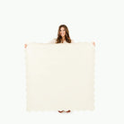 Ivory Scallop / Square@Woman holding the Ivory Scallop Square Midi Mat