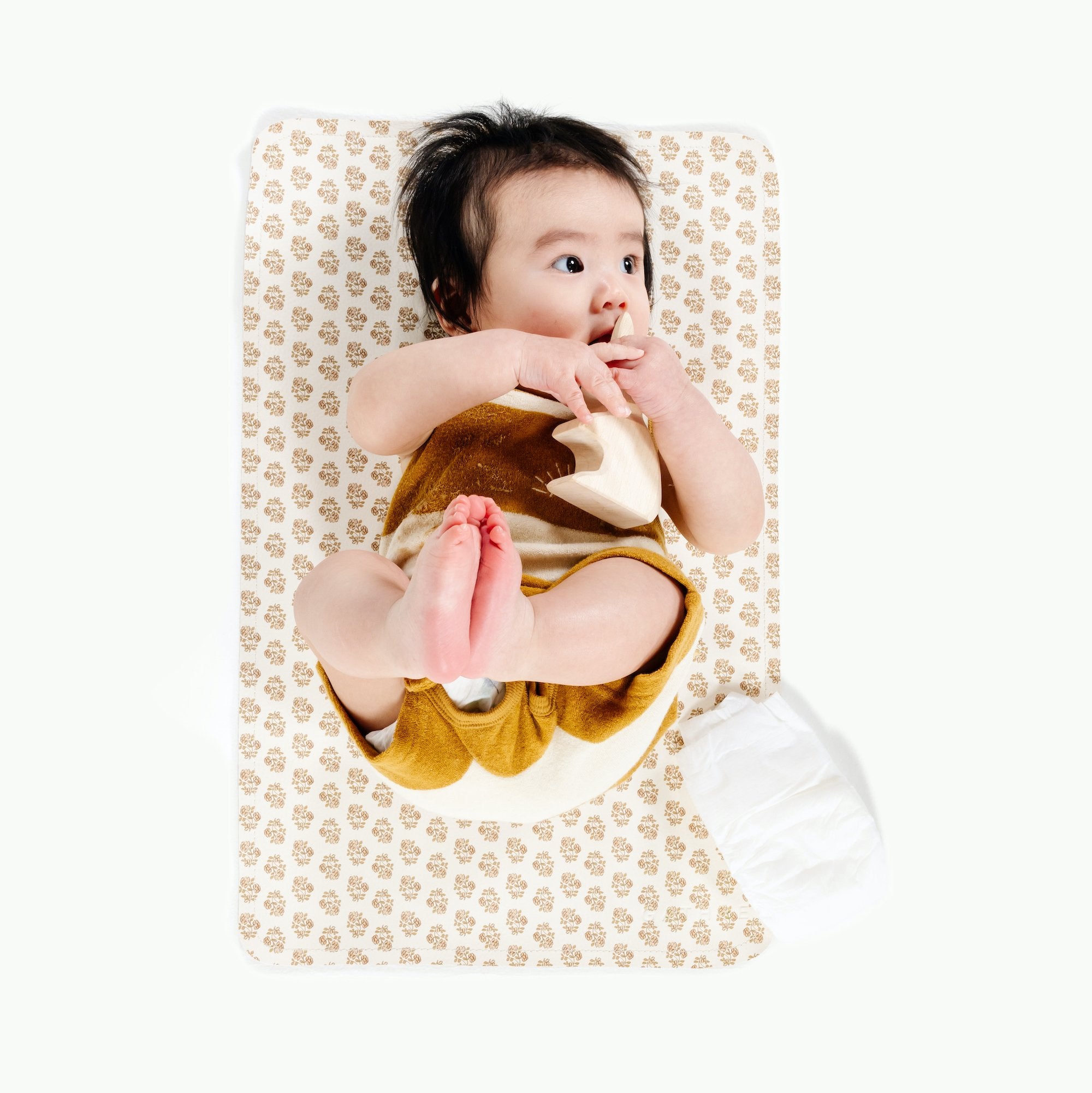 Bloom (on sale)@Overhead of baby on the Bloom Micro Mat