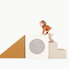 Camel • Ivory • Stone Stripe • Millet@Baby playing on the camel block playset