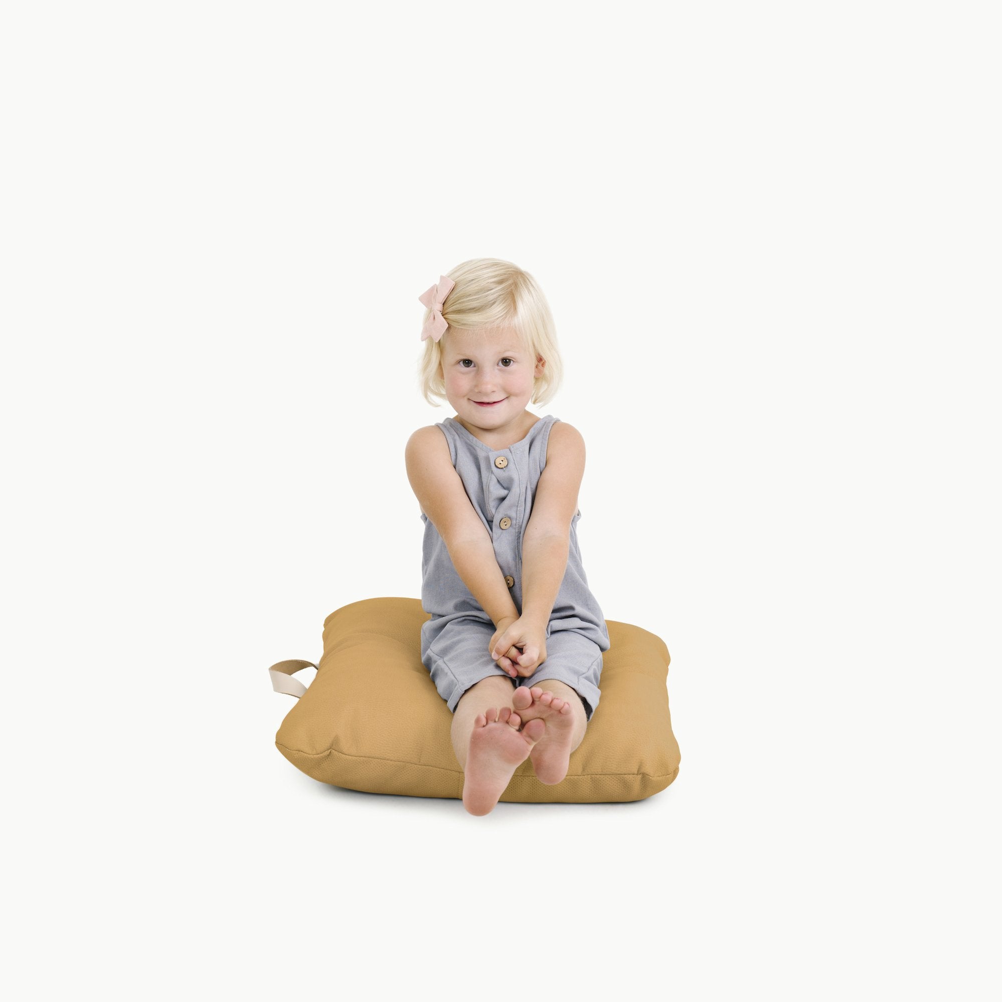 Camel / Square@kid sitting on the Camel Mini Square Floor Cushion