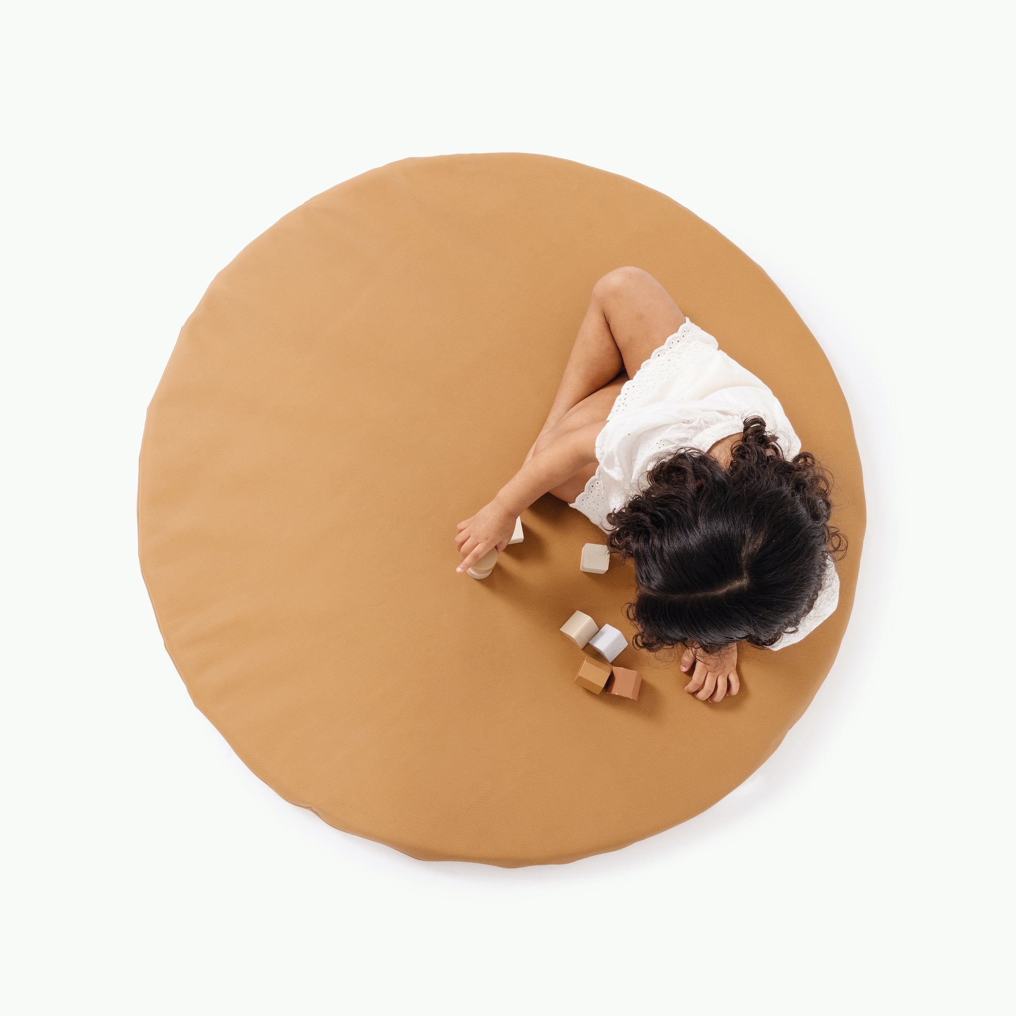Camel / Circle@overhead of kid playing on the camel padded mini circle