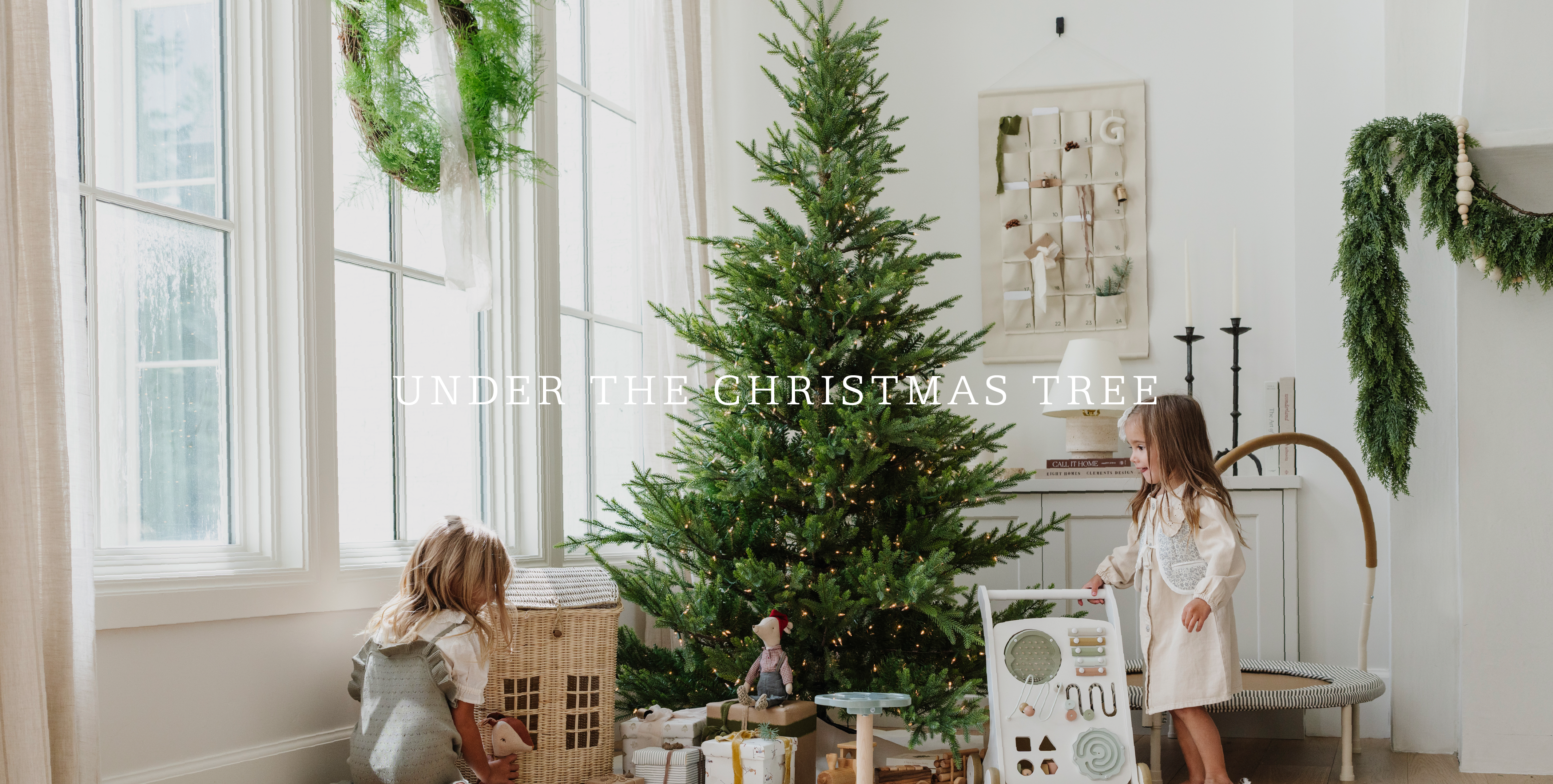 Under the Christmas tree. Kids playing with toys under a Christmas Tree.