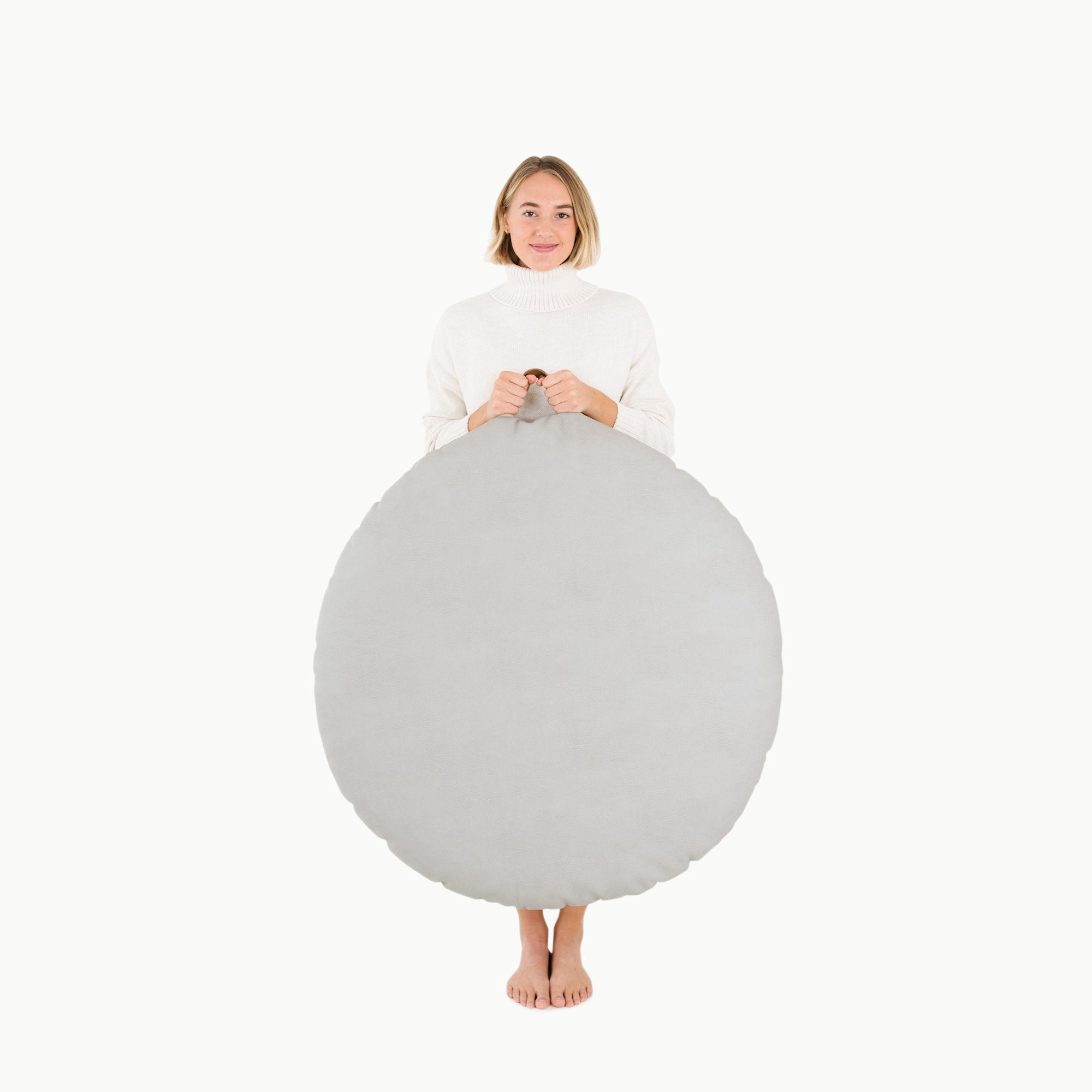 Pewter (on sale) / Circle@Woman holding the Pewter Circle Floor Cushion