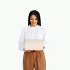 Pebble (on sale)@Woman holding a folded Pebble Maxi Mat