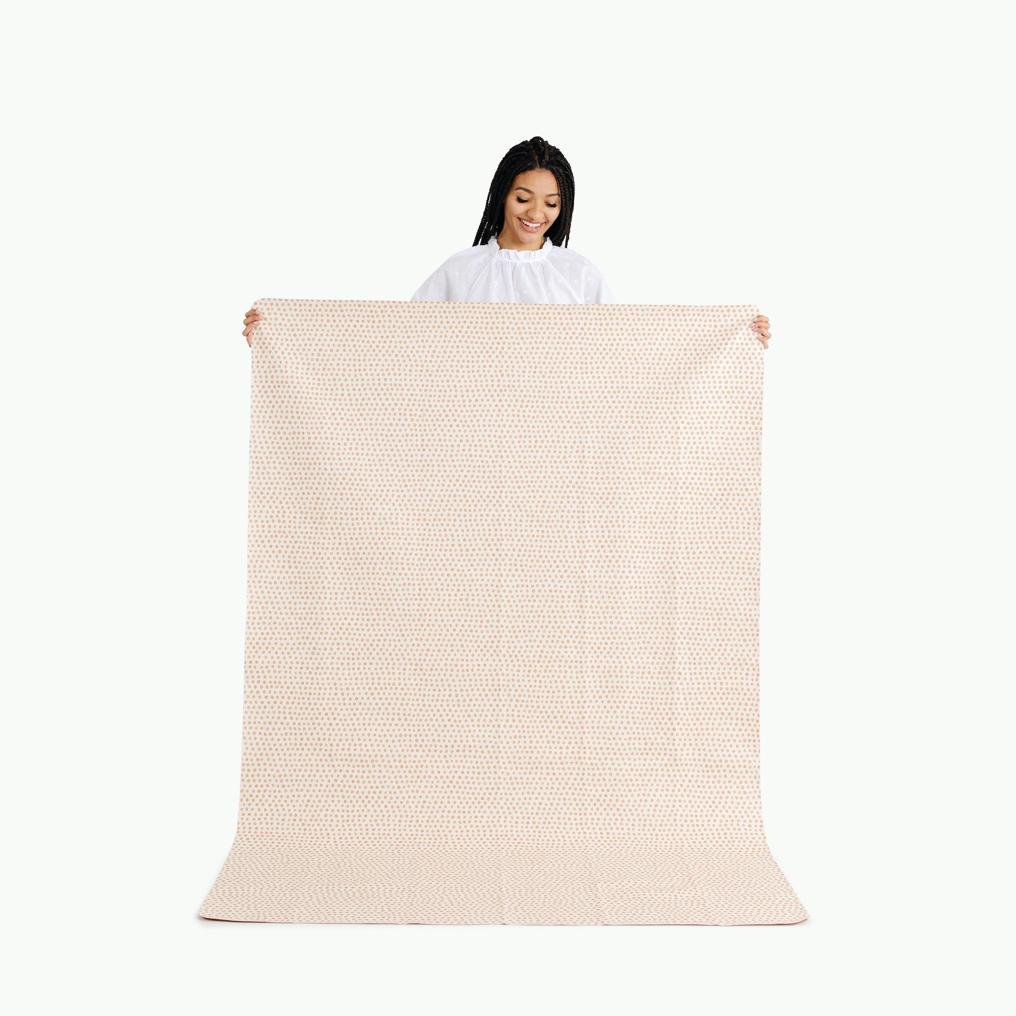 Pebble (on sale) / 6 Foot@woman holding 6 foot pebble tablecloth