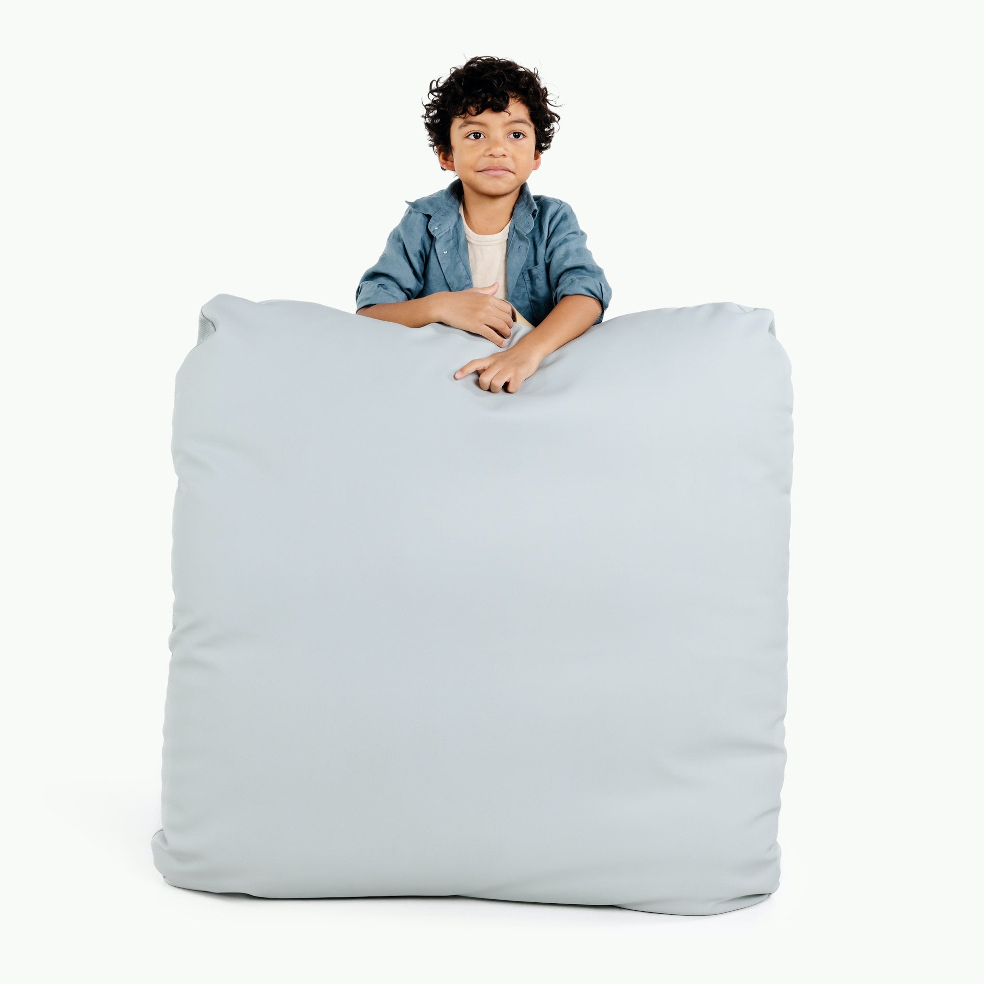 Dawn (on sale) / Square@Kid holding the Dawn Square Floor Cushion