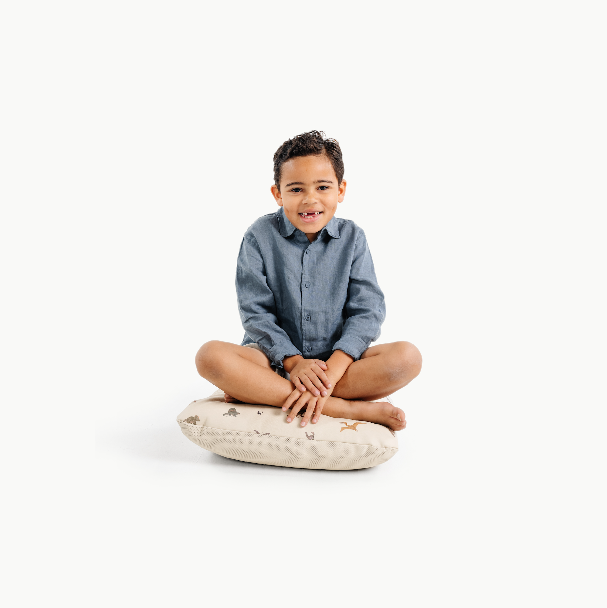 Dinosauria (on sale) / Square@little boy sitting on a mini cushion