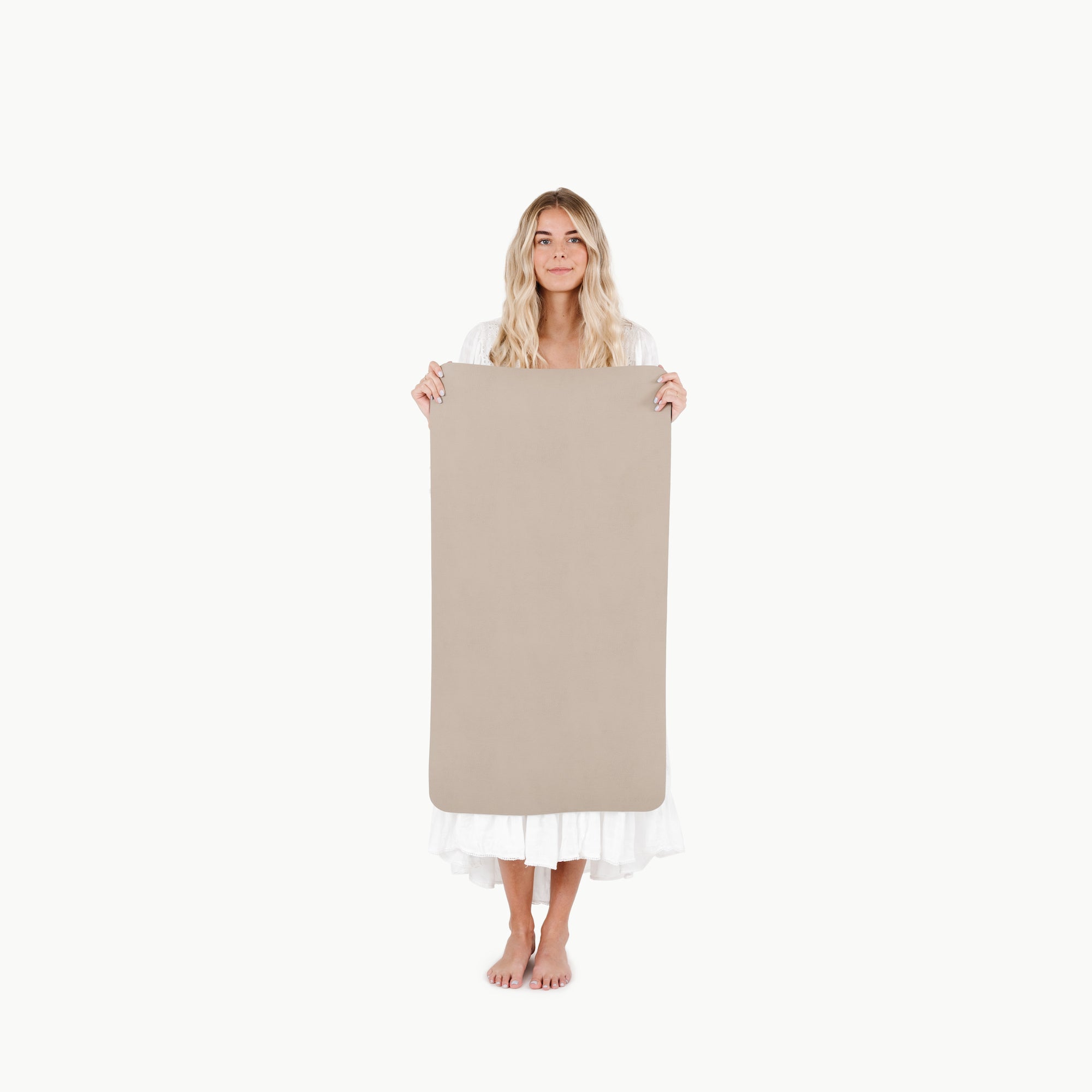 Ember (on sale)@woman holding the small ember home mat