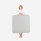 Pewter (on sale) / Square@Woman holding the Pewter Square Floor Cushion