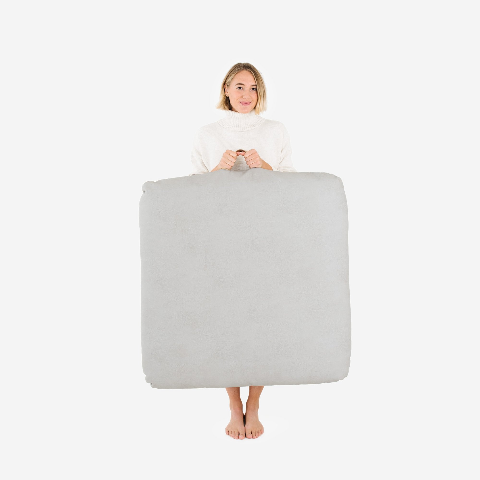 Pewter (on sale) / Square@Woman holding the Pewter Square Floor Cushion