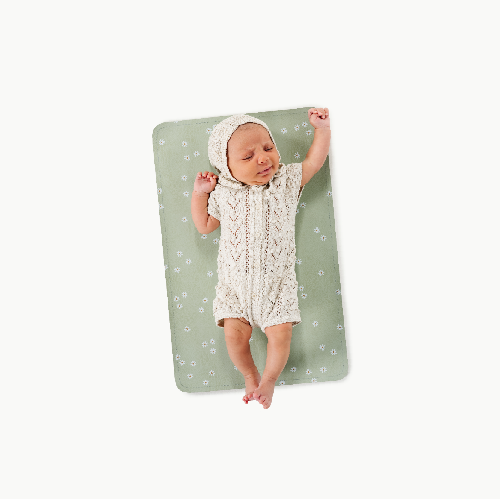 Flora@baby lying on a micro changing mat