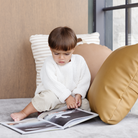 Ochre (on sale)@Boy looking in book by FW23 Mini Floor Cushions