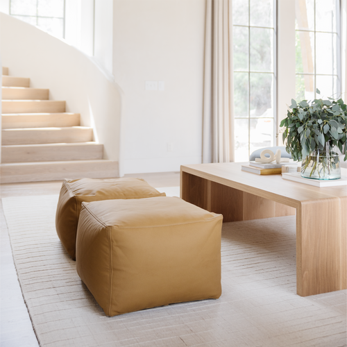 Ochre (on sale)@Ochre Poufs shown in home by coffee table