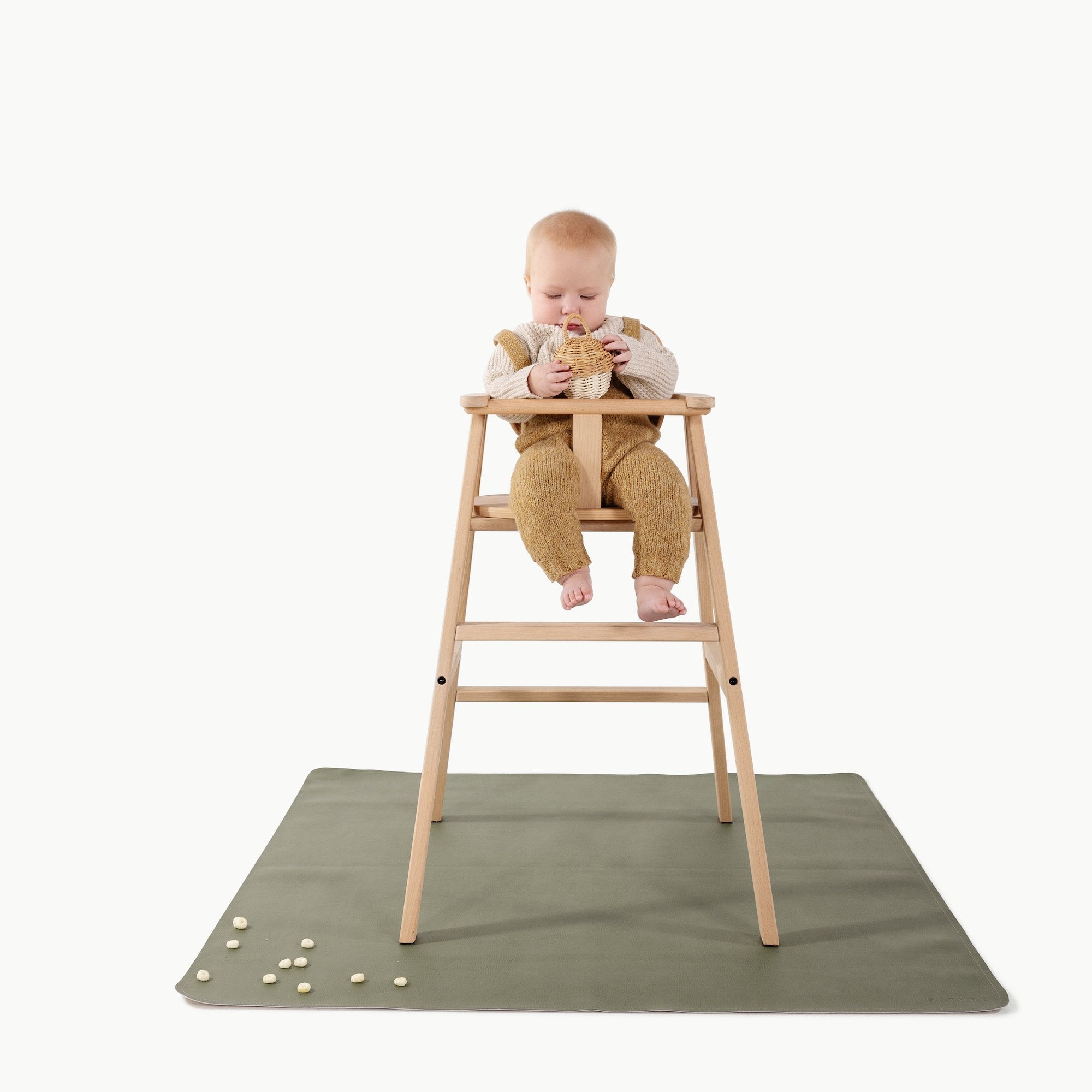 Thyme@Baby in a high chair on the Thyme Mini Mat