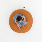 Ginger (on sale) / Circle@Overhead of kid sitting on the Ginger Circle Floor Cushion