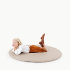 Ember (on sale)@kid sitting on the ember padded midi circle