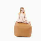 Camel / Square@Kid sitting on the Camel Square Pouf