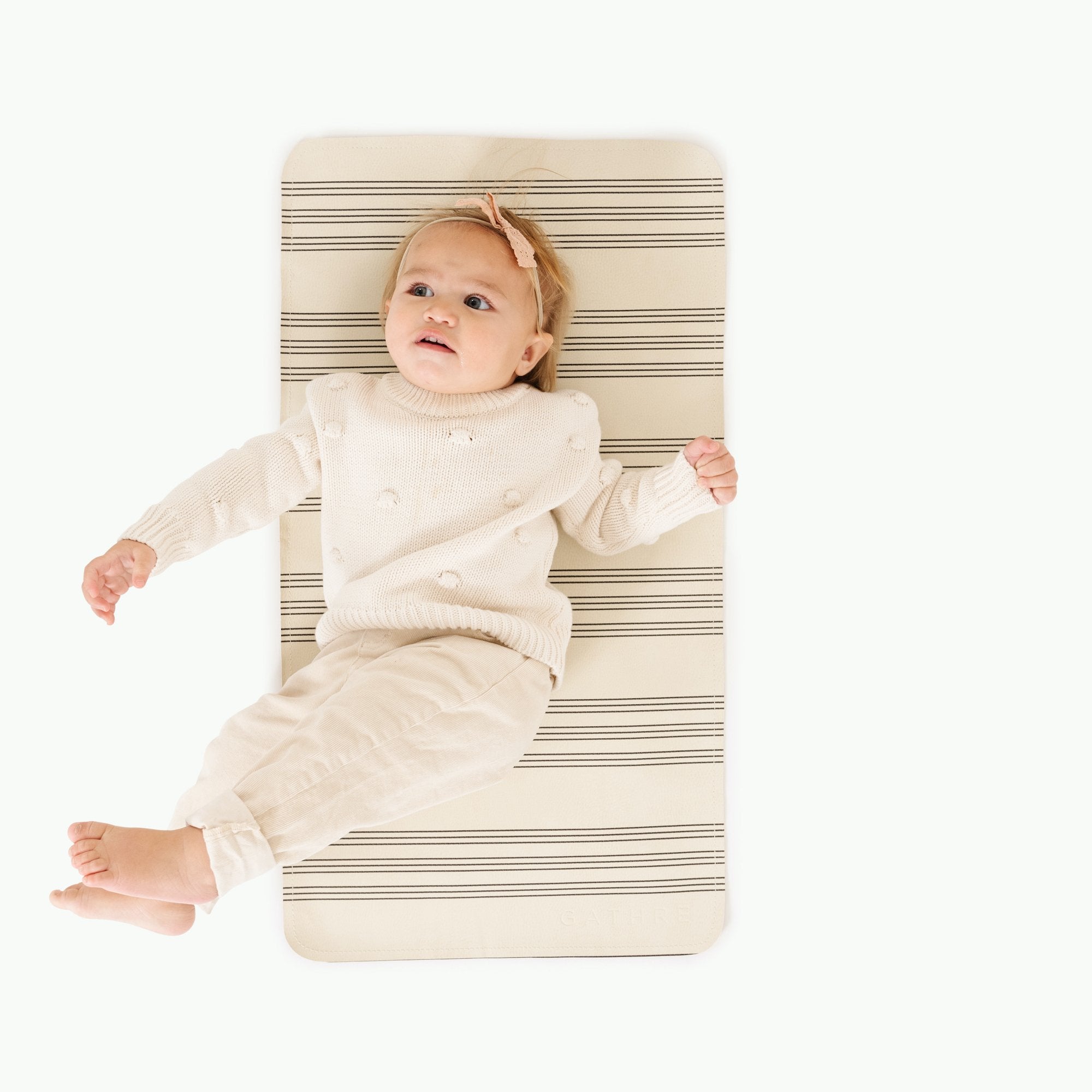 Pencil Stripe (on sale)@Overhead of baby laying on the Pencil Stripe Micro+ Mat