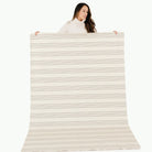 Pencil Stripe (on sale) / 6 Foot@woman holding pencil stripe tablecloth