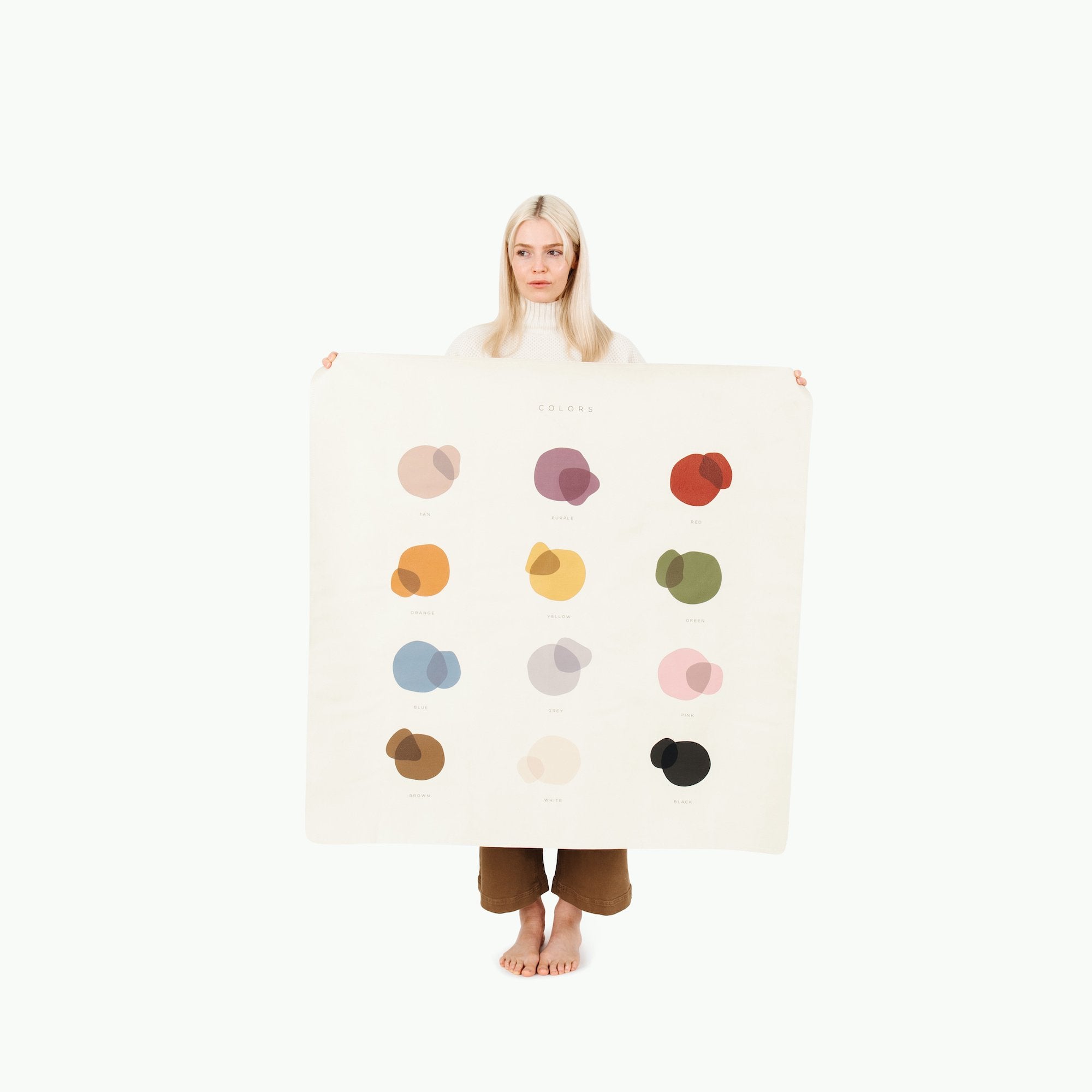 Colors@Woman holding the Colors Mini Mat