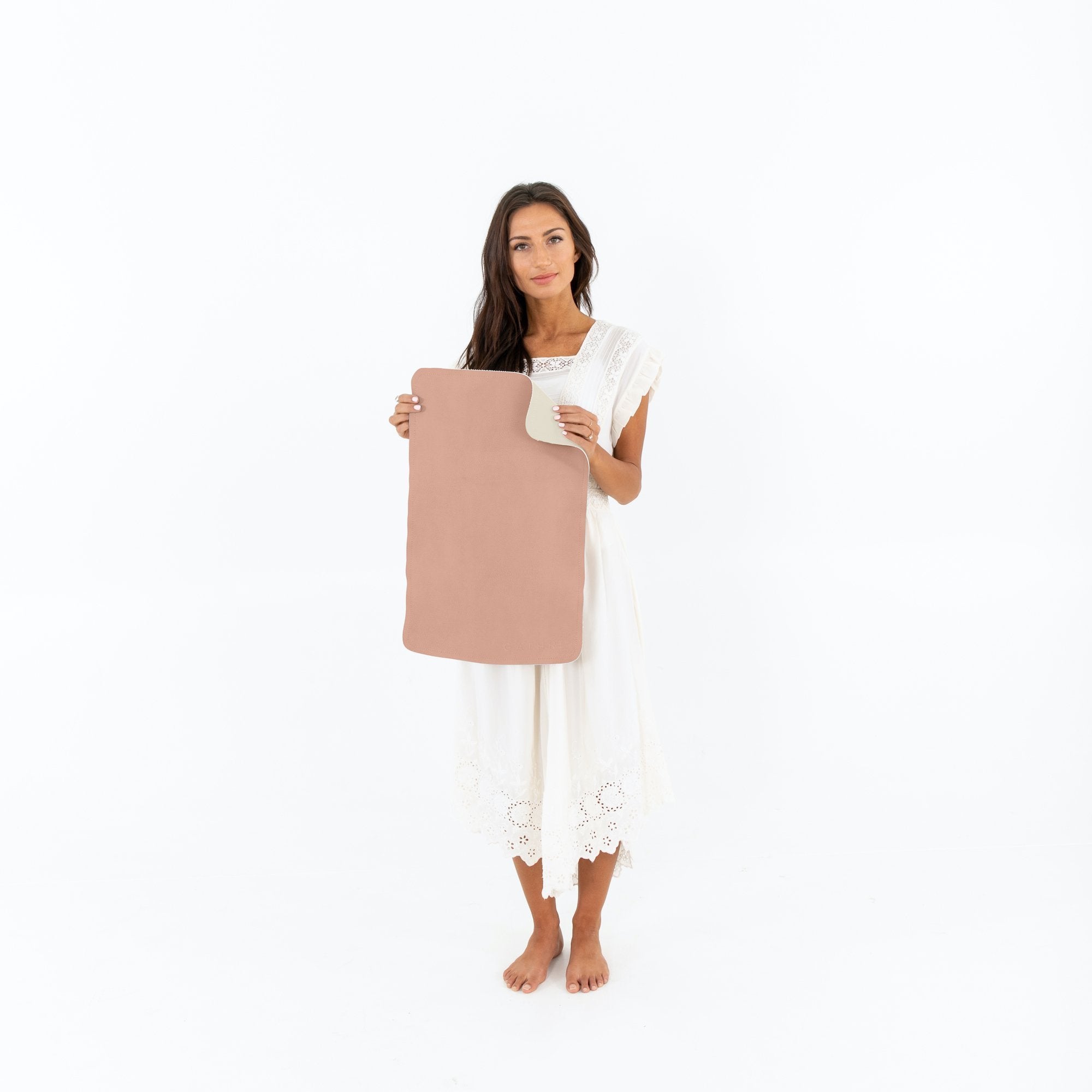 Sienna • Blanc (on sale)@Woman holding the Sienna/Blanc Micro Mat