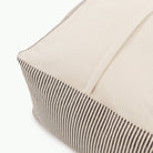 Stone Stripe / Square@Detail shot of perforated side of Stone Stripe Square Pouf