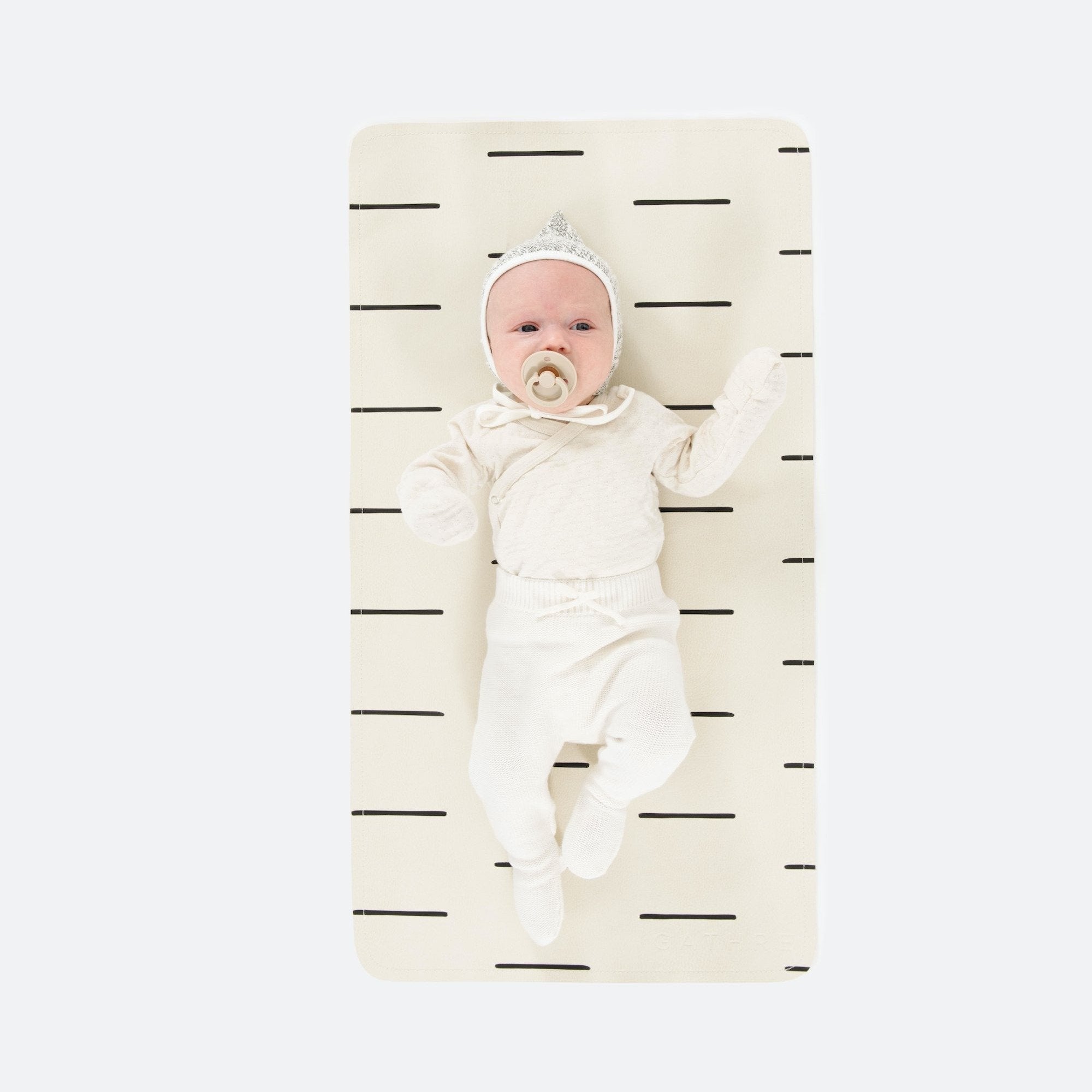 Blanc Dash (on sale)@Overhead of baby laying on the Blanc Dash Micro+ Mat