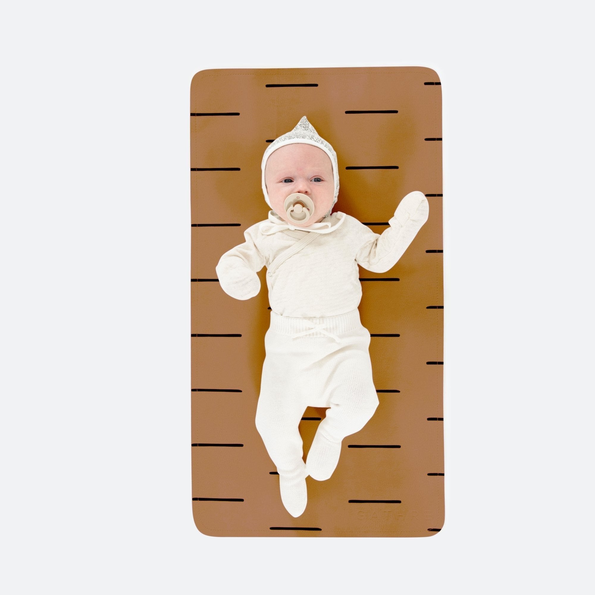 Camel Dash (on sale)@Overhead of baby laying on the Camel Dash Micro+ Mat
