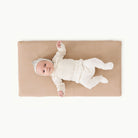 Untanned (on sale)@Overhead of baby laying on untanned padded micro+