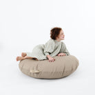 Ember (on sale) / Circle@Kid laying on the Ember Circle Floor Cushion
