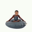 Nightfall (on sale) / Circle@Kid sitting on the Nightfall Circle Floor Cushion