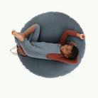Nightfall (on sale) / Circle@Overhead kid laying on the Nightfall Circle Floor Cushion