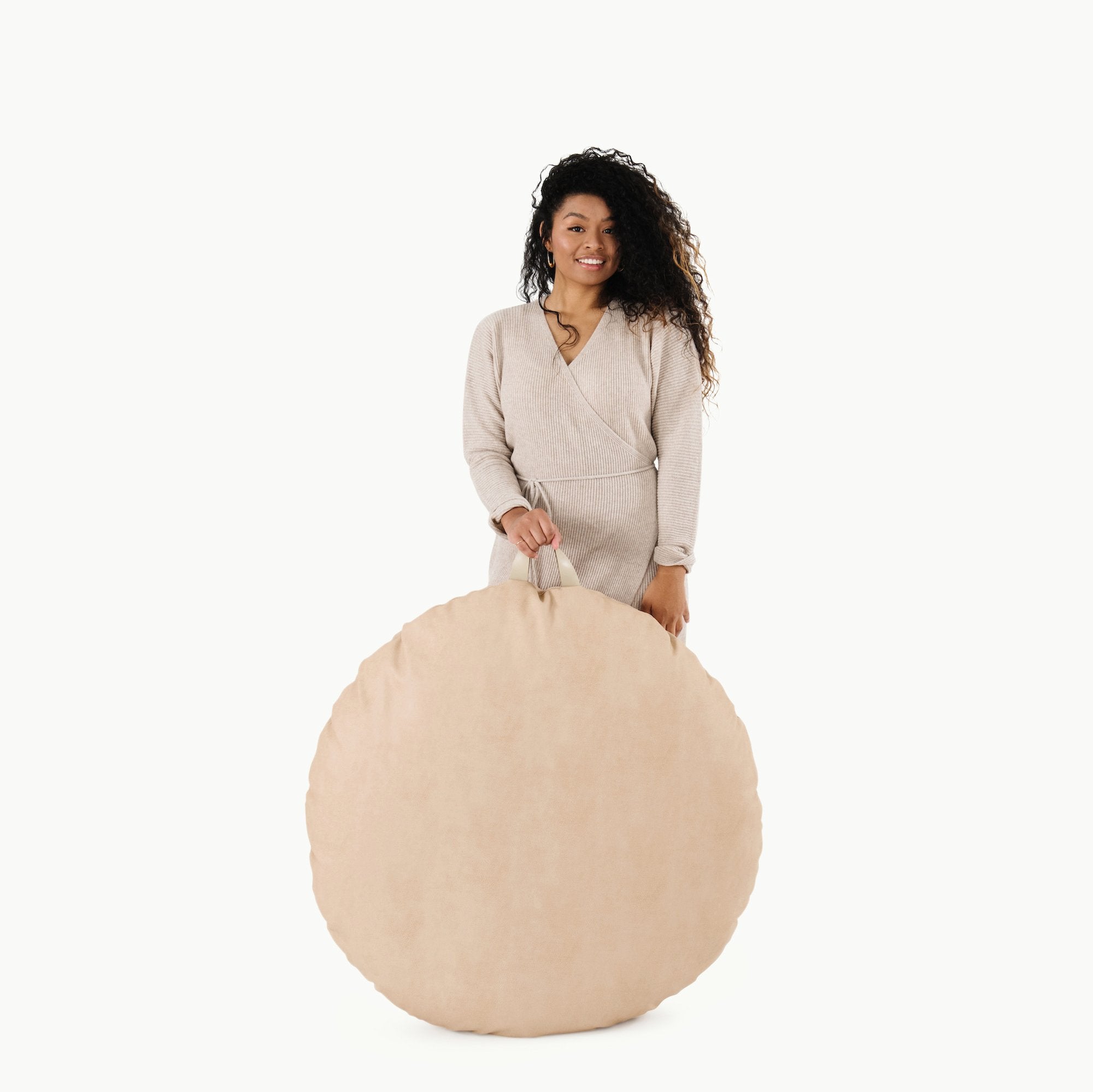 Untanned  (on sale) / Circle@Woman holding the Untanned Circle Floor Cushion