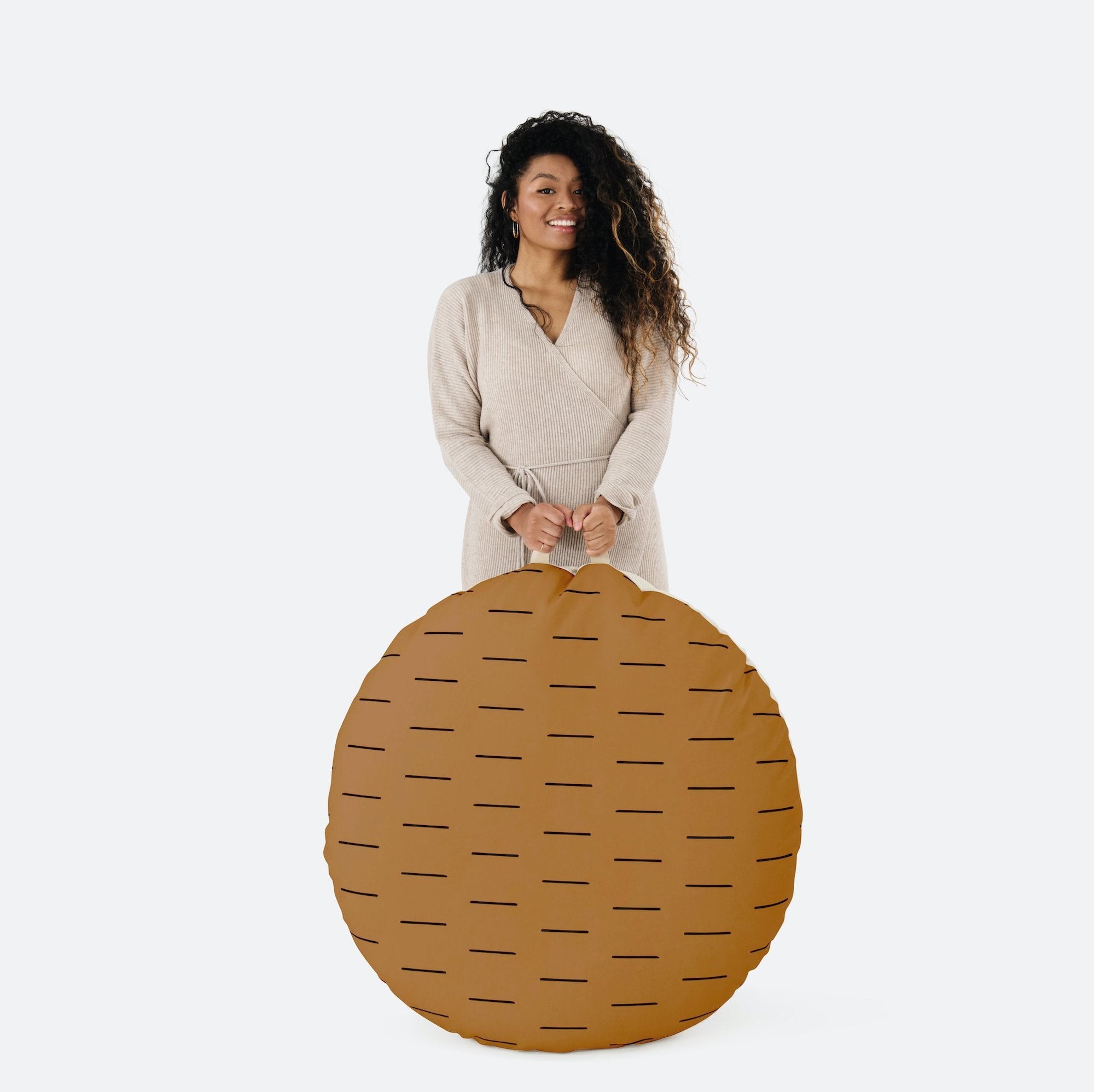 Camel Dash (on sale) / Circle@Woman holding the Camel Dash Circle Floor Cushion