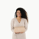 Untanned (on sale)@Woman holding a folded Untanned Maxi Mat