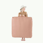 Sienna (on sale) / Square@Woman holding the Sienna Square Floor Cushion