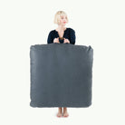 Nightfall (on sale) / Square@Woman holding the Nightfall Square Floor Cushion