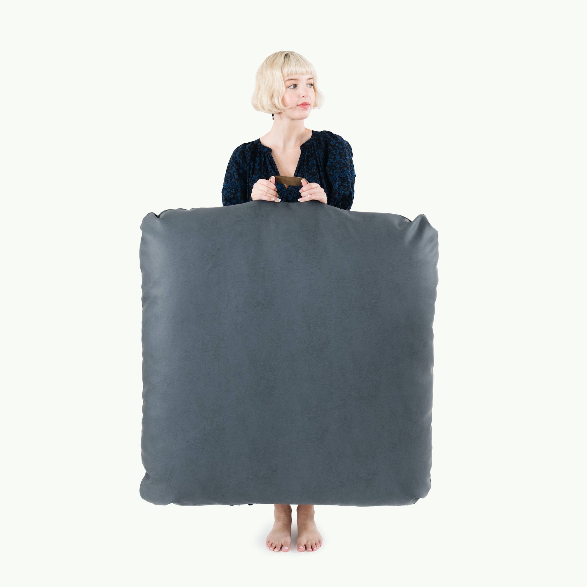 Nightfall (on sale) / Square@Woman holding the Nightfall Square Floor Cushion