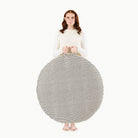 Stone Stripe / Circle@Woman holding the Stone Stripe Circle Floor Cushion