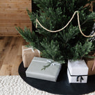 Raven (on sale)@lifestyle image with a tree skirt