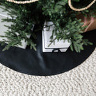 Raven (on sale)@lifestyle image with a tree skirt