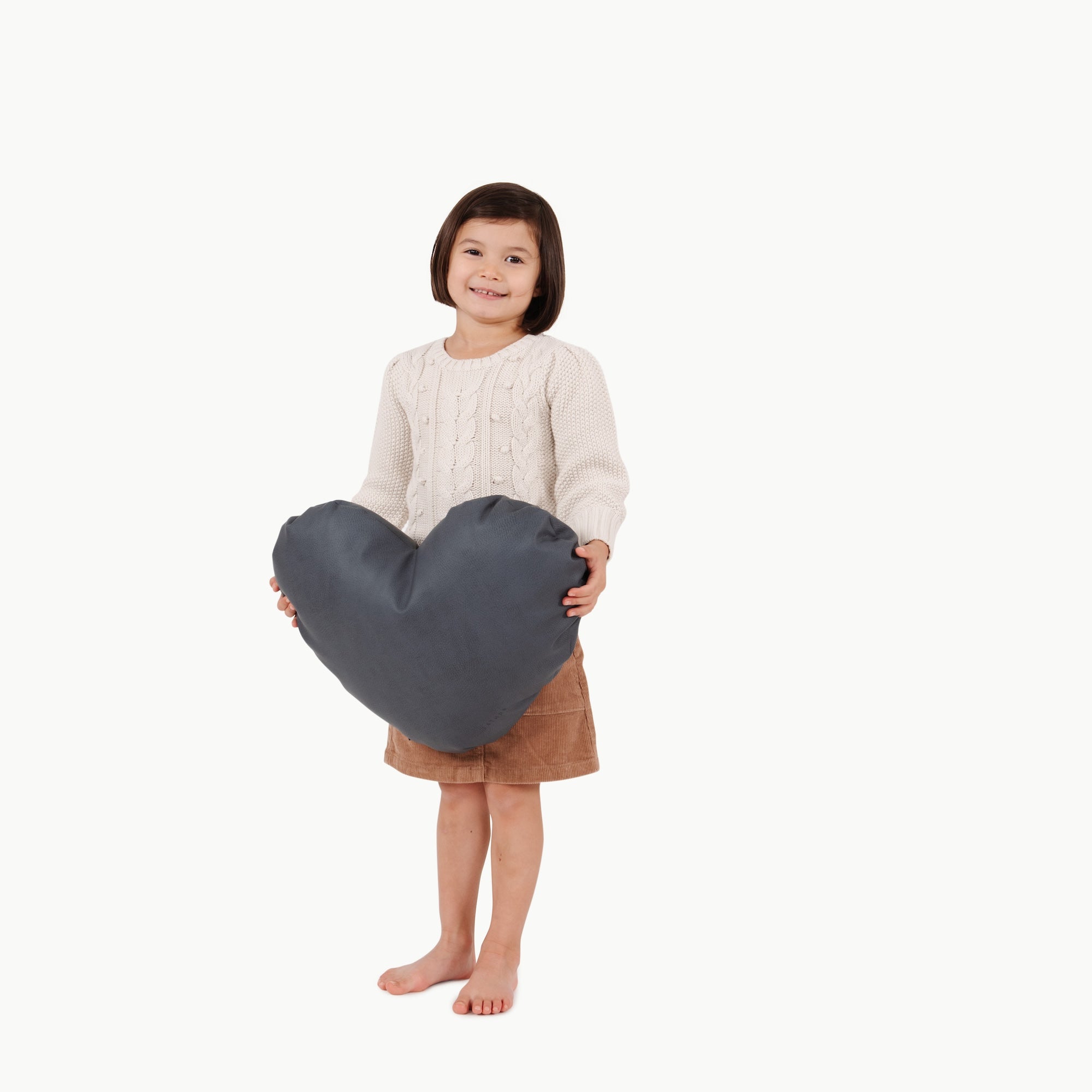 Nightfall (on sale)@little girl holding heart pillow