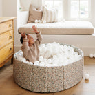 Joanna Bloom@lifestyle image of little boy playing in ball pit