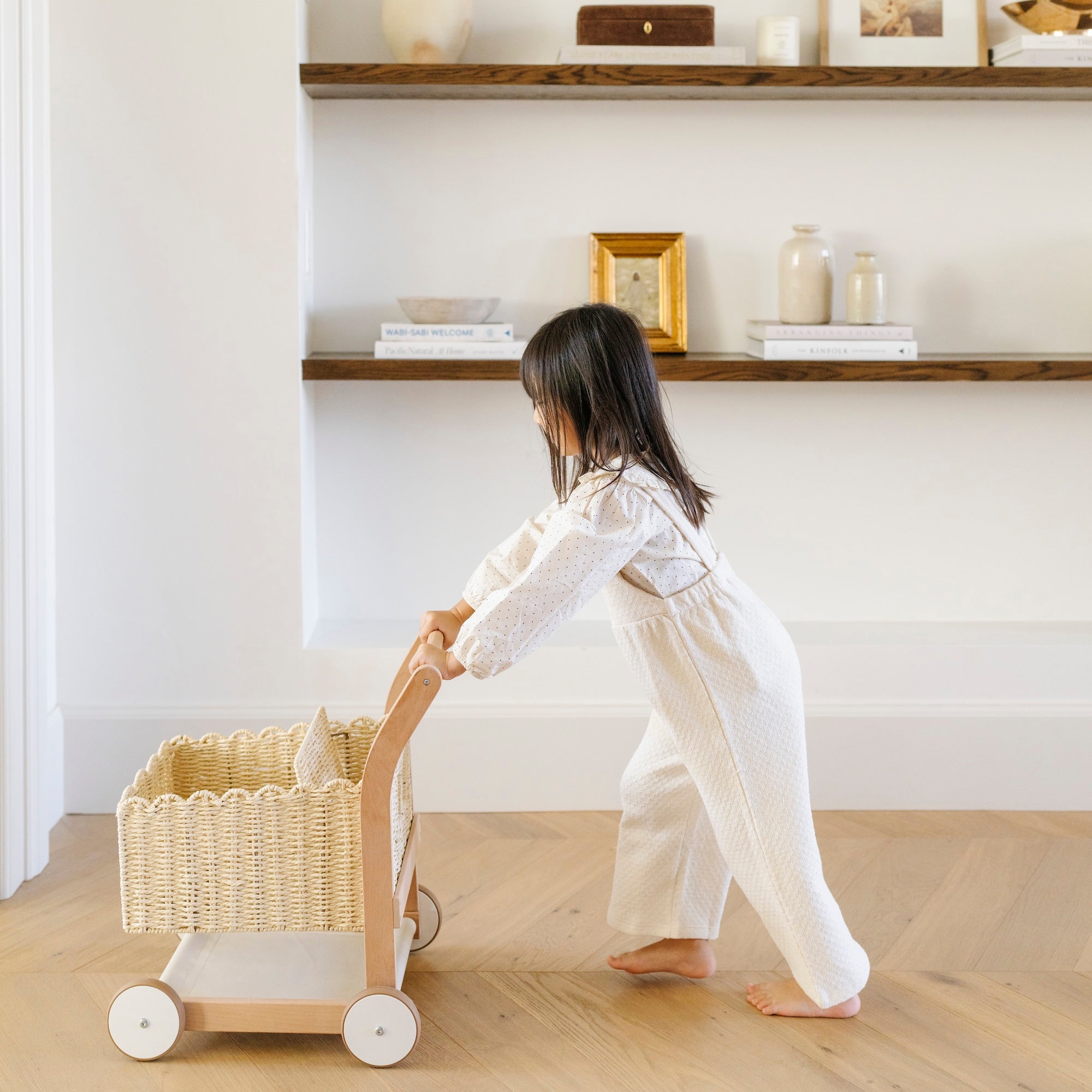 Ivory@lifestyle image of girl playing with a shopping trolley