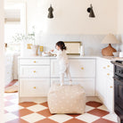 Mickey Mouse (on sale) / Square@Kid standing on the Mickey Mouse Square Pouf in a home