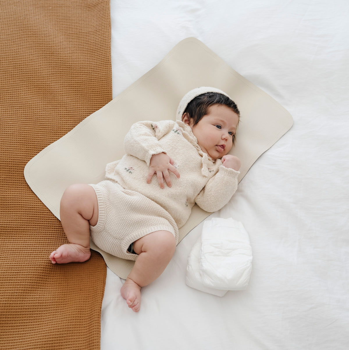 Ivory@Baby sitting on the Ivory Micro mat