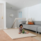 Cafe Stripe@Child rolling and playing on a comfortable tumbling mat