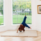 Millet@Child rolling and playing on a comfortable tumbling mat