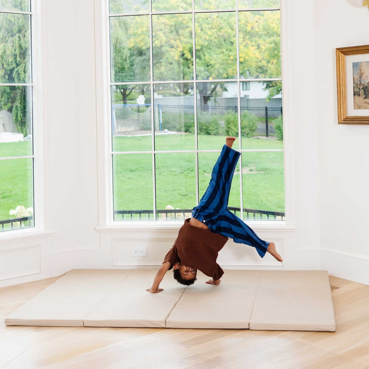 Millet@Child rolling and playing on a comfortable tumbling mat