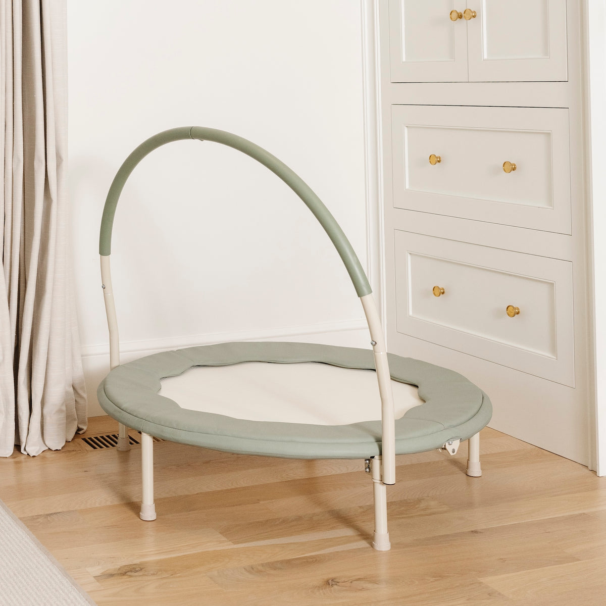 Palm / Scallop@Modern indoor trampoline for kids styled in a neutral home space